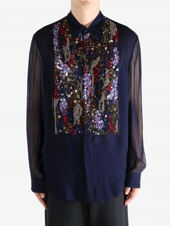 Navy blue shirt worn by a person, showing the shirt's fit