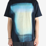 Blue t-shirt worn by a person, showing the shirt fit