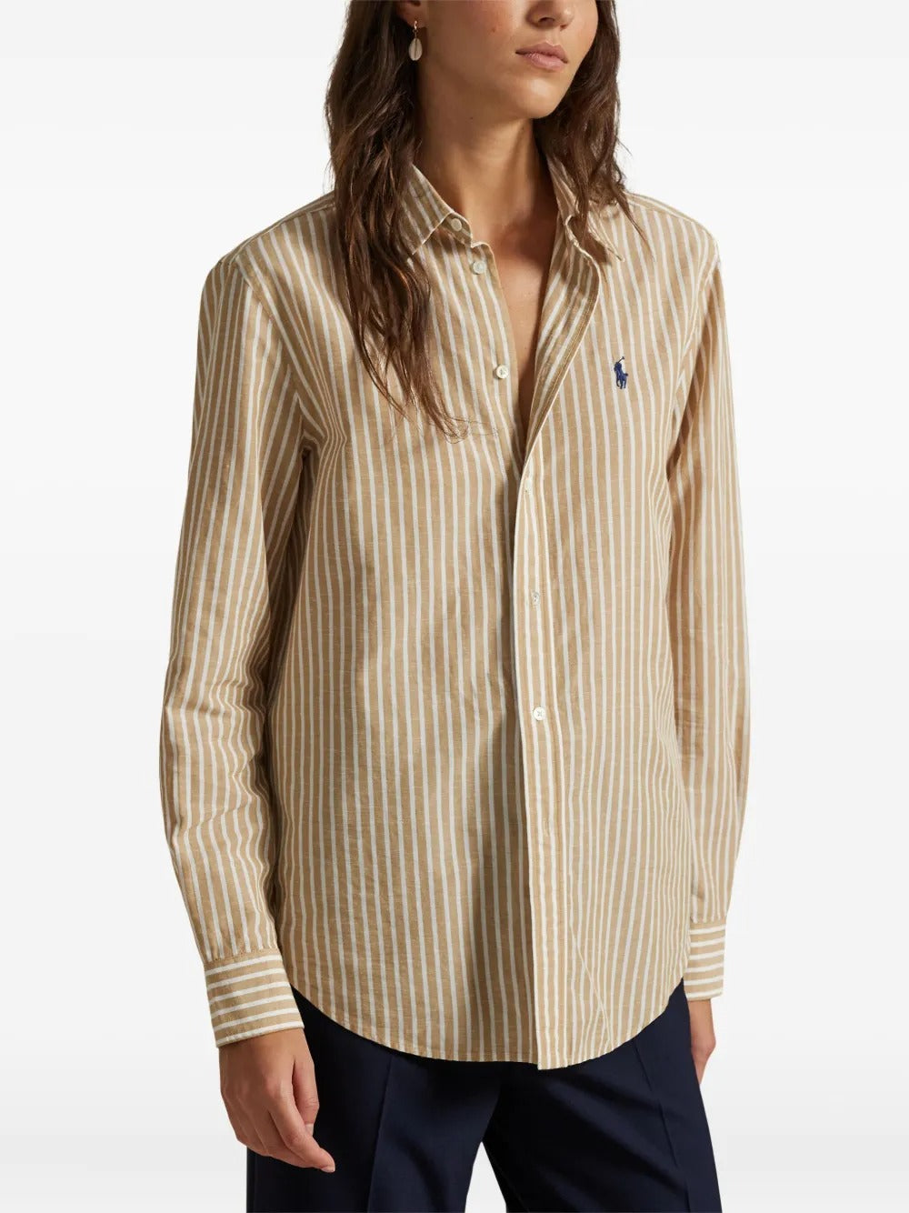 Tan shirt worn by a person, showing the shirt's fit
