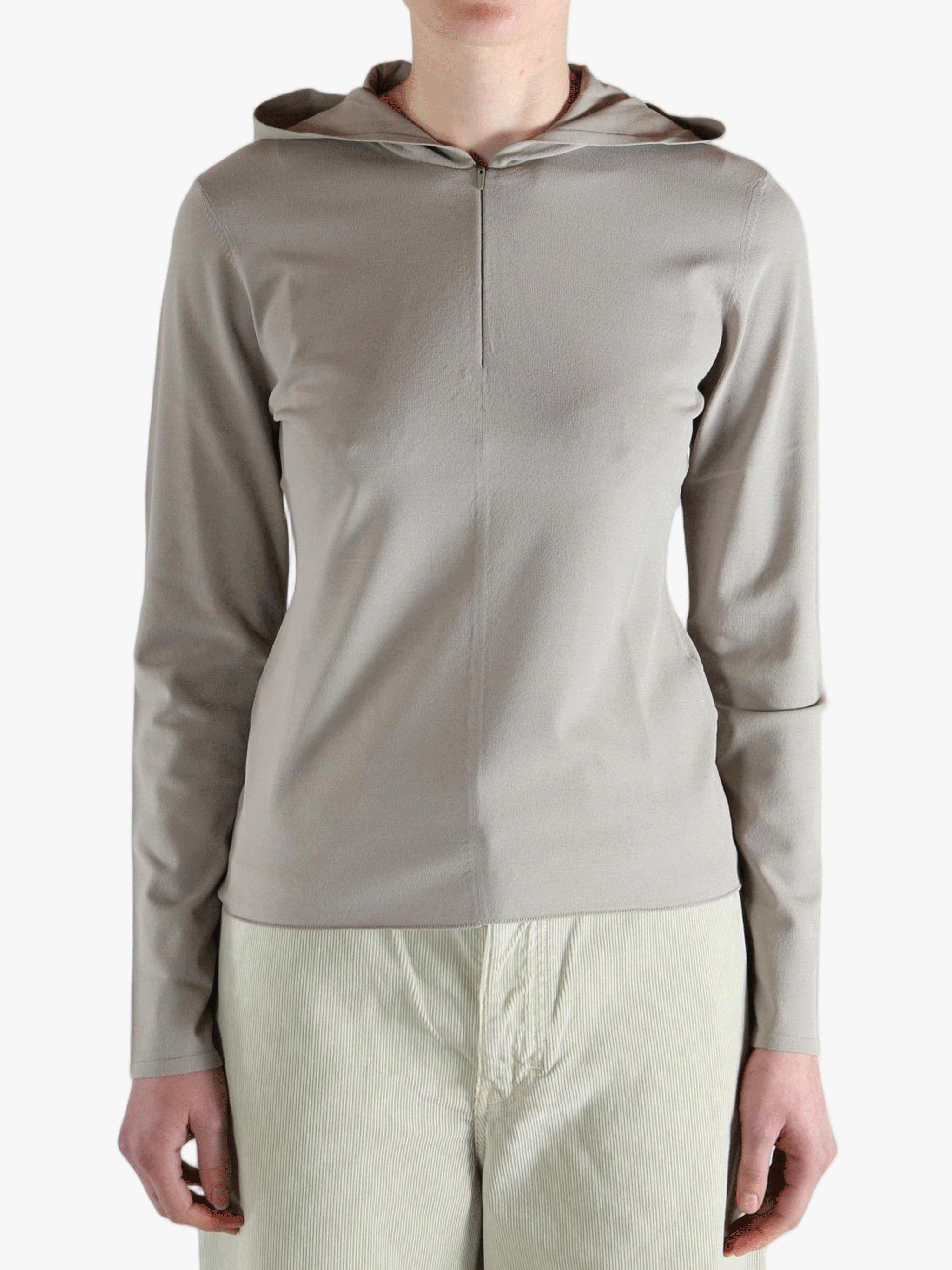 Grey knitwear worn by a person, showing the knitwear fit