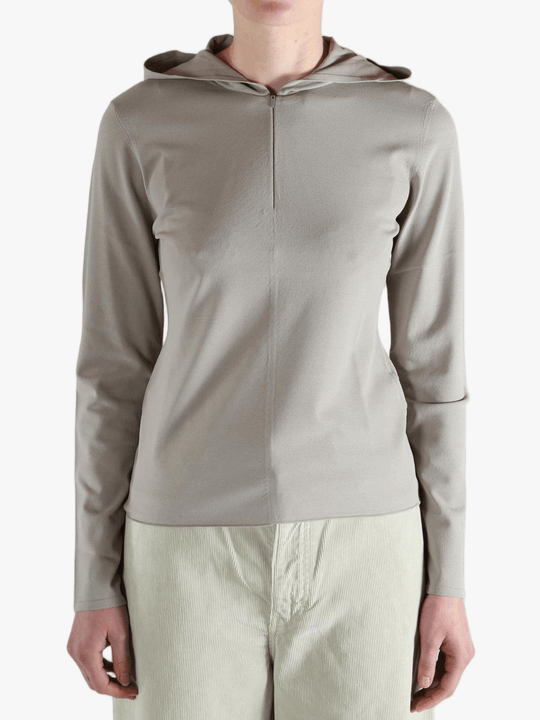 Grey knitwear worn by a person, showing the knitwear fit
