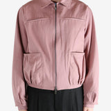 Pink jacket worn by a person, showing the jacket fit