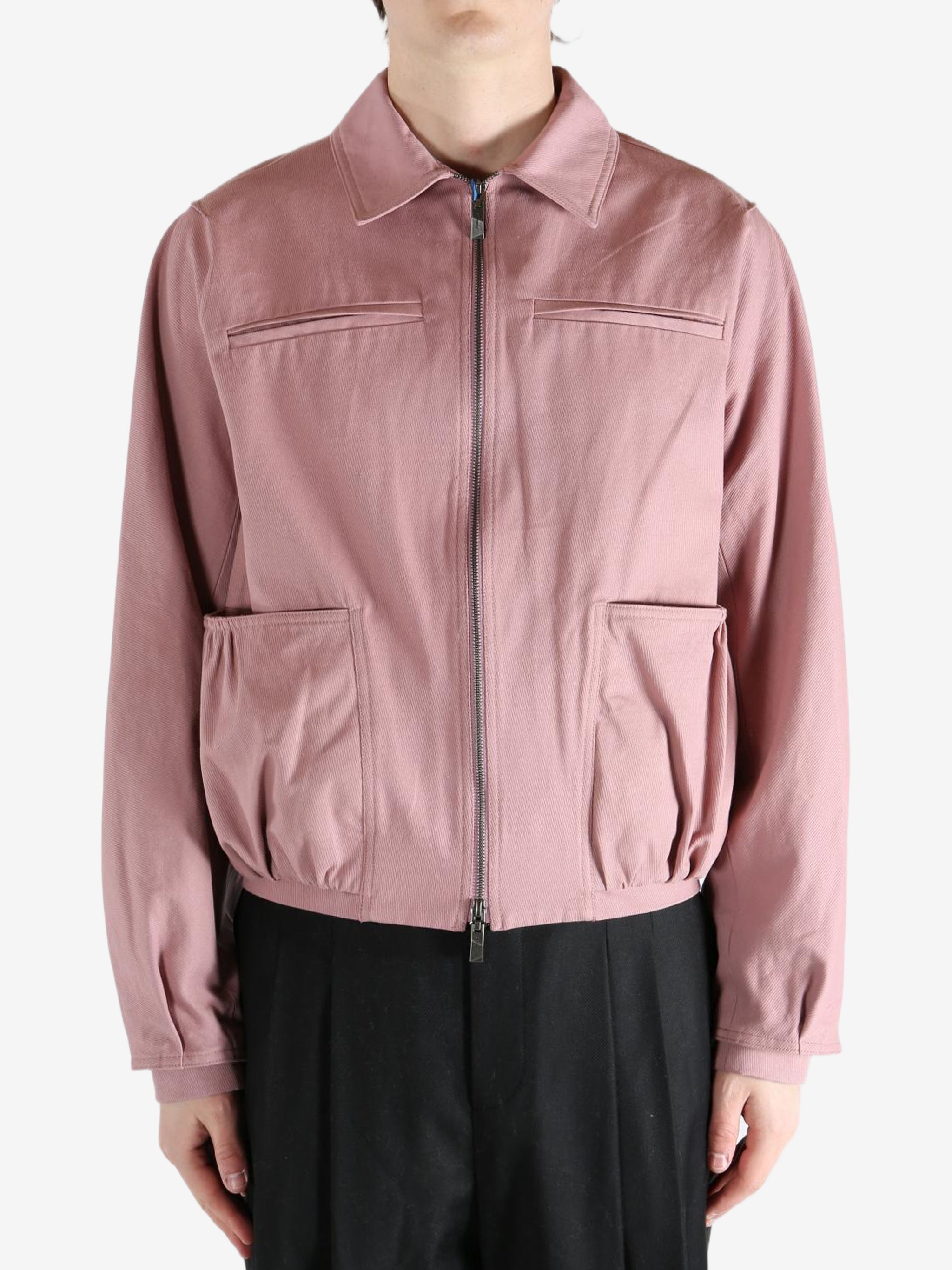 Pink jacket worn by a person, showing the jacket fit