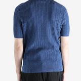 Navy t-shirt worn by a person, showing the shirt's fit