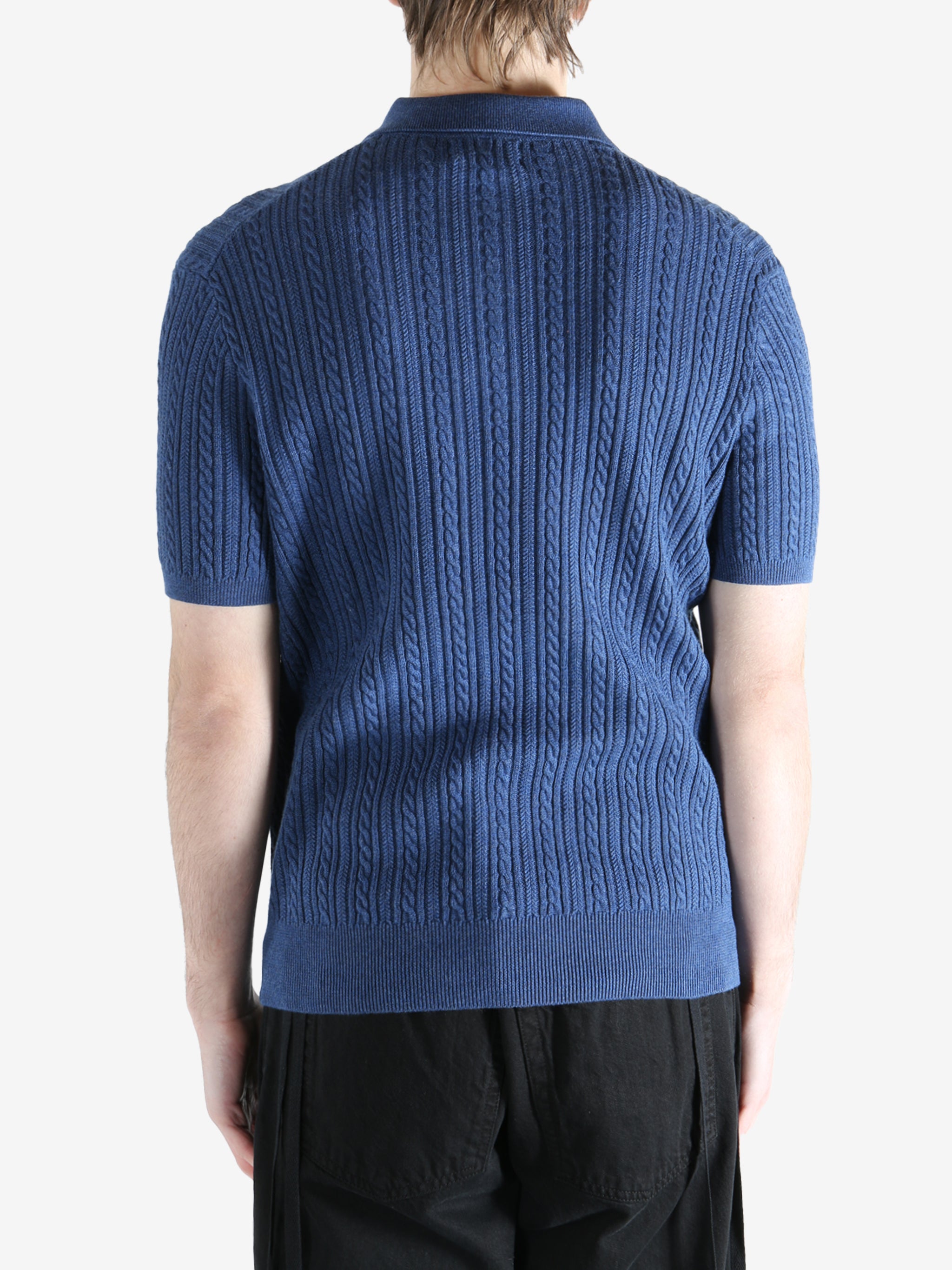 Navy t-shirt worn by a person, showing the shirt's fit