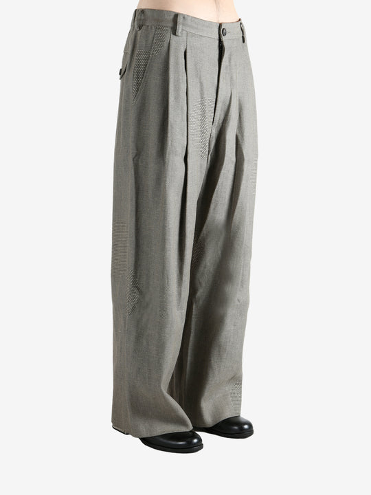 Grey pants worn by a person, showing the pants' fit