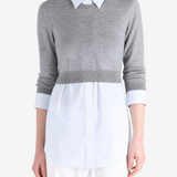 Grey top worn by a person, showing the top fit