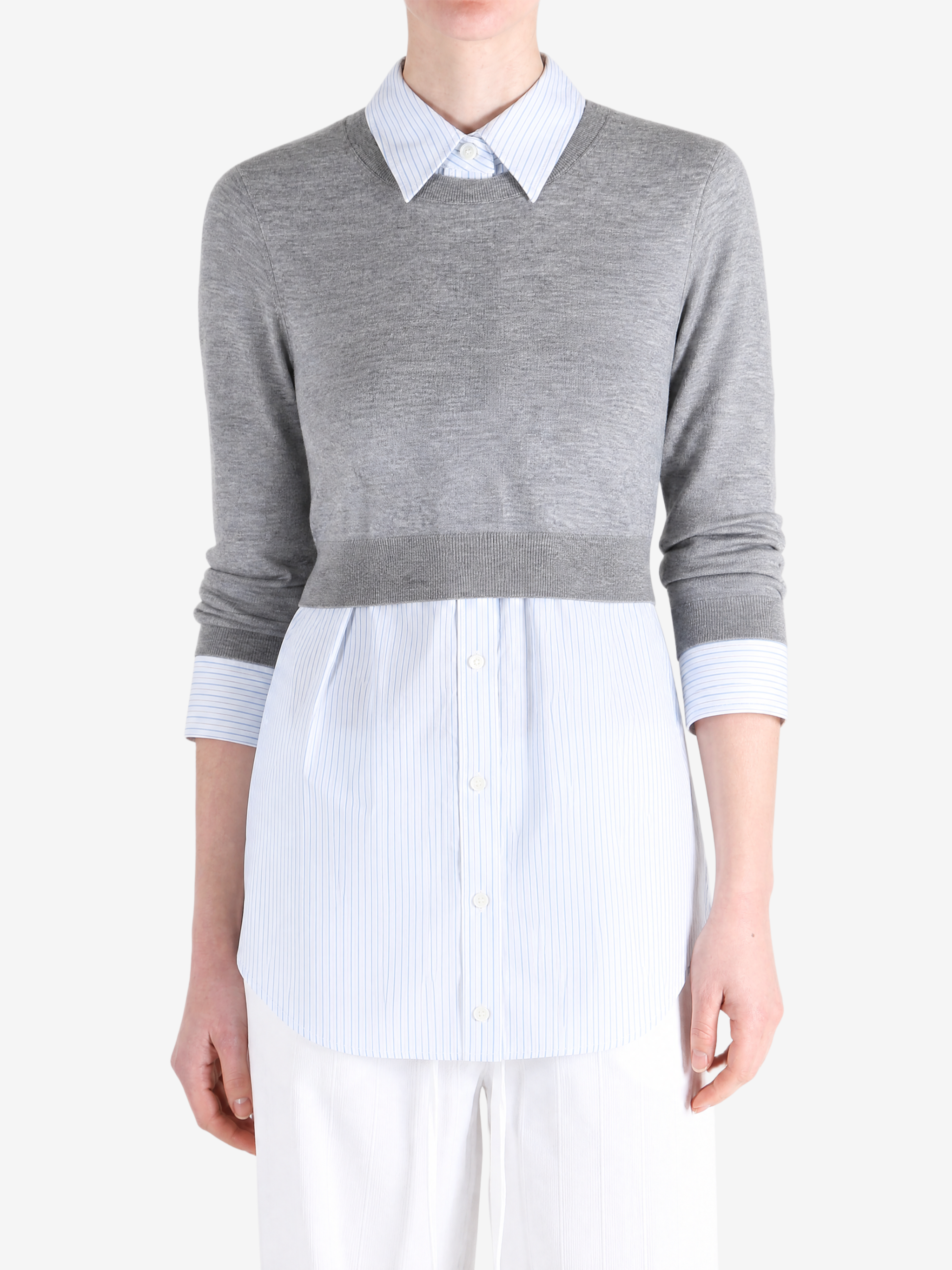 Grey top worn by a person, showing the top fit