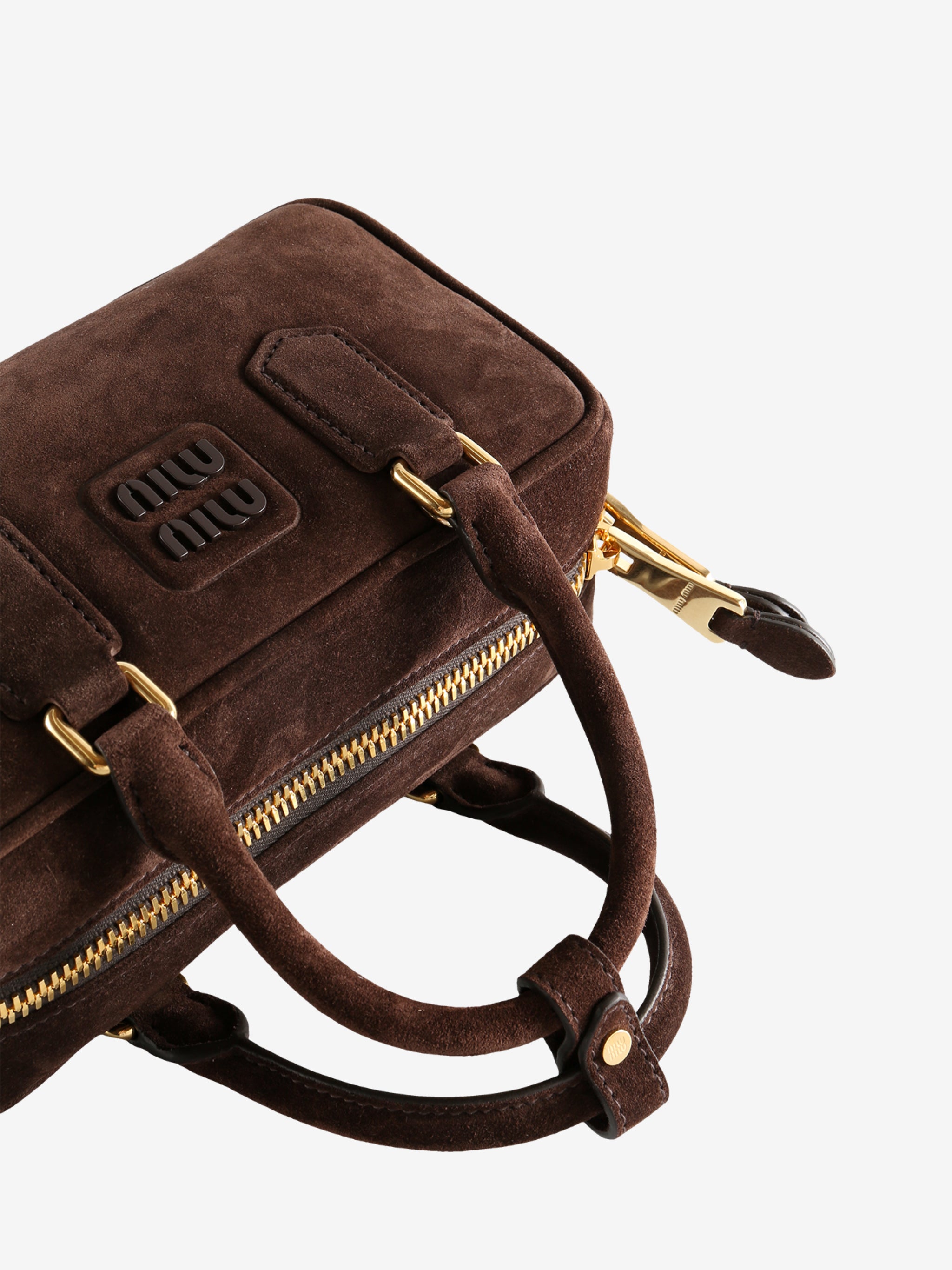 Close up of the brown bag, showing texture of the calfskin fabric