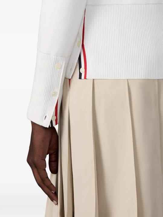 Close up of white cardigan,showing texture of the cotton fabric