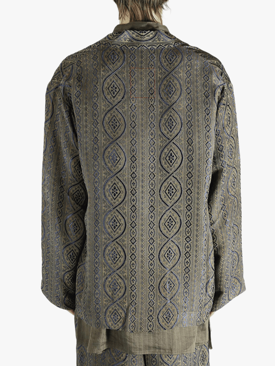 Blue jacket worn by a person, showing the jacket's fit