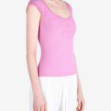Pink top worn by a person, showing the top fit