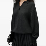 Black dress worn by a person, showing the dress fit