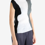 White shirt worn by a person, showing the shirt's fit