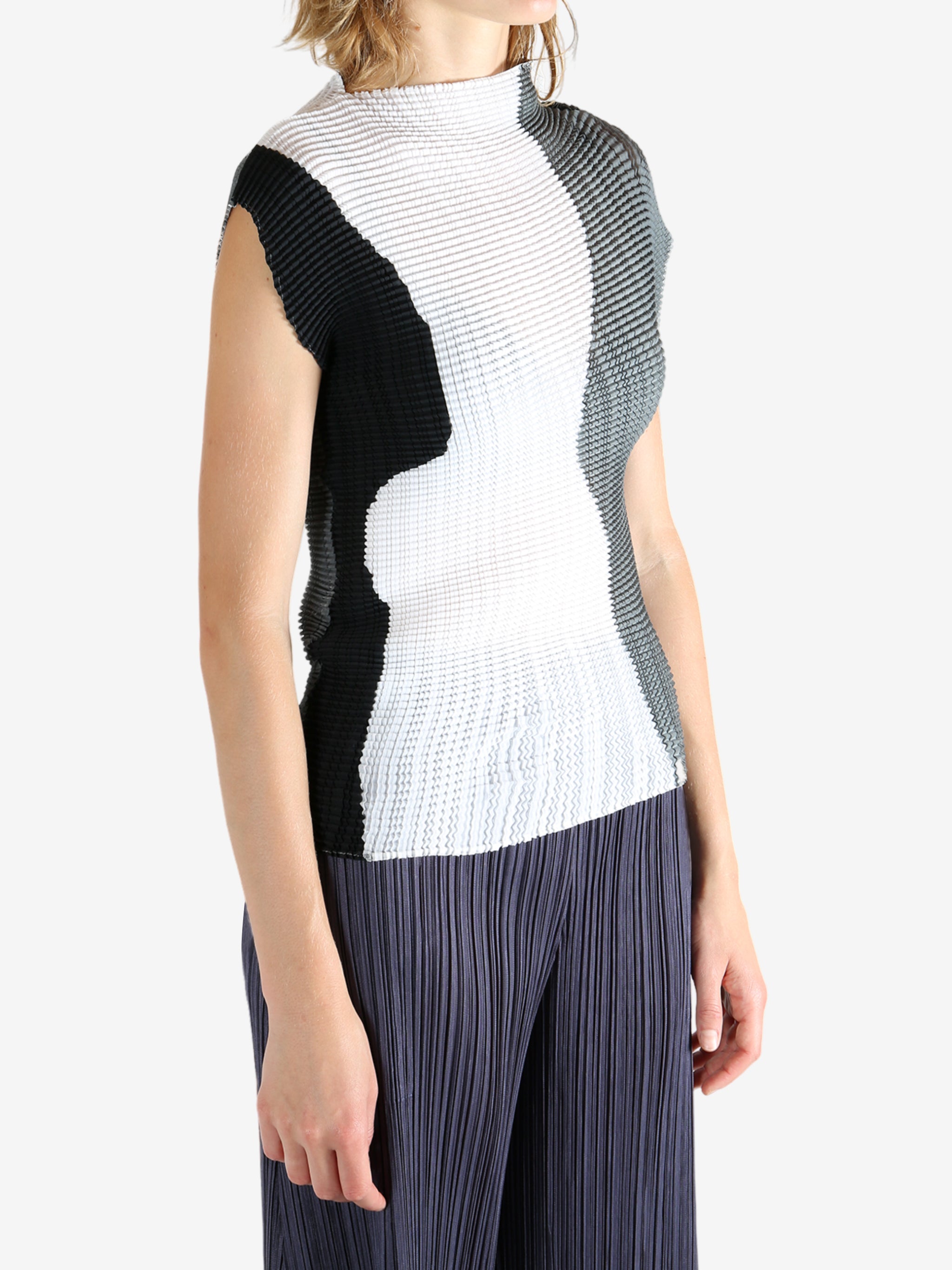 White shirt worn by a person, showing the shirt's fit