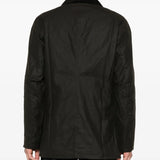 Brown jacket worn by a person, showing the jacket's fit