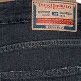 Black jeans worn by a person, showing the jeans fit