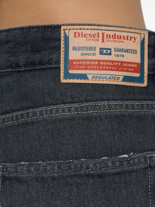 Black jeans worn by a person, showing the jeans fit