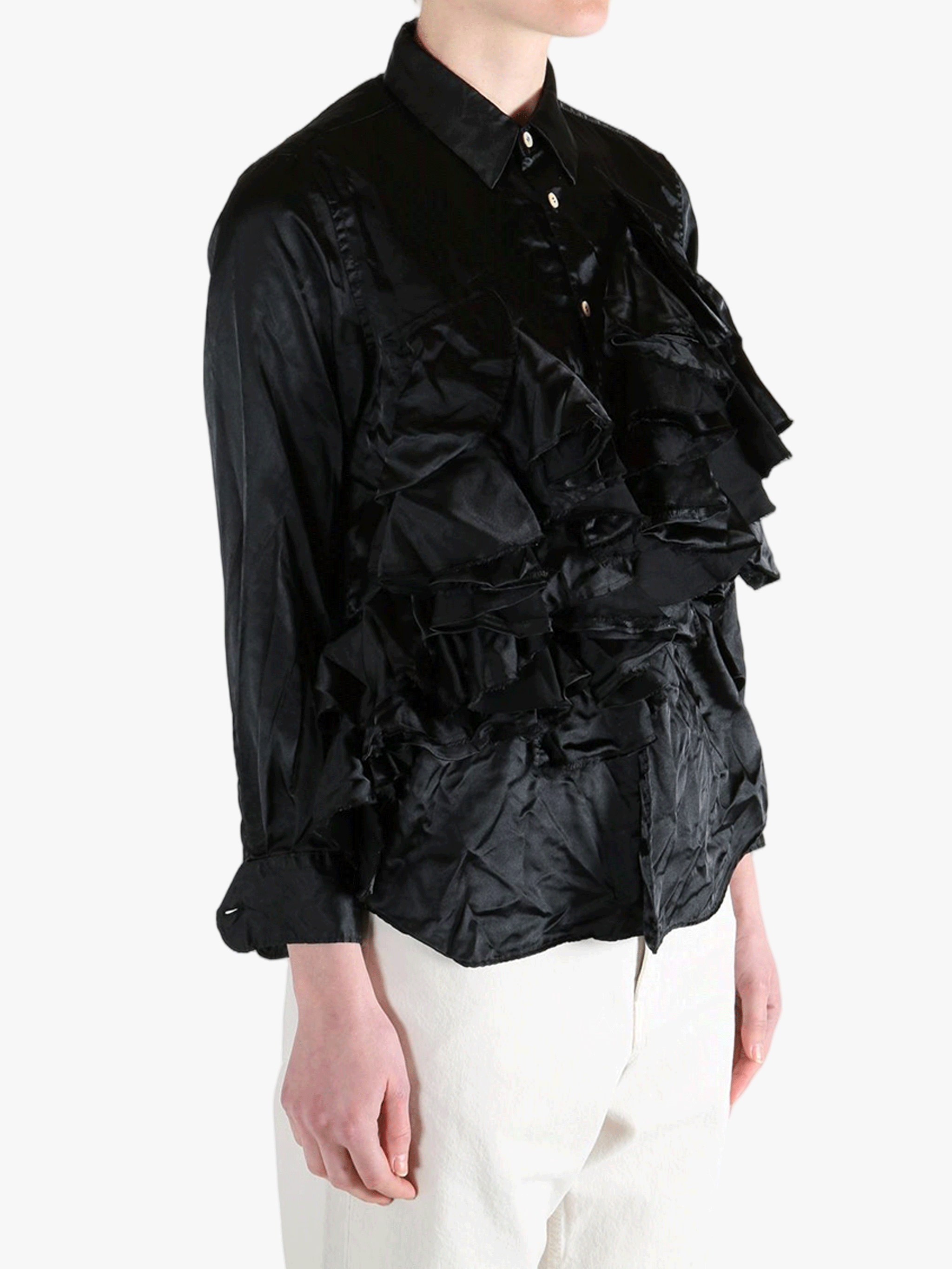 Black shirt worn by a person, showing the shirt's fit