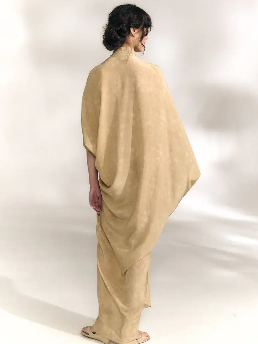 Yellow dress worn by a person, showing the dress' fit