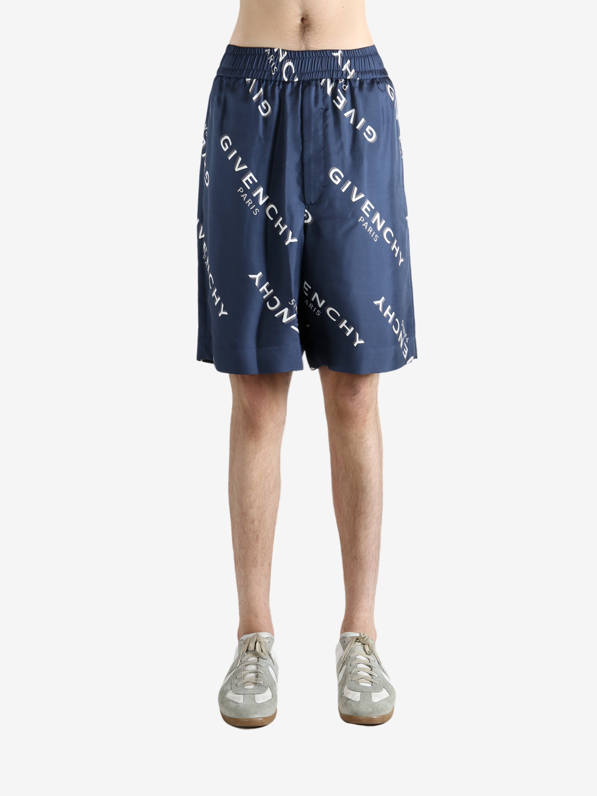 Navy short worn by a person, showing the short fit