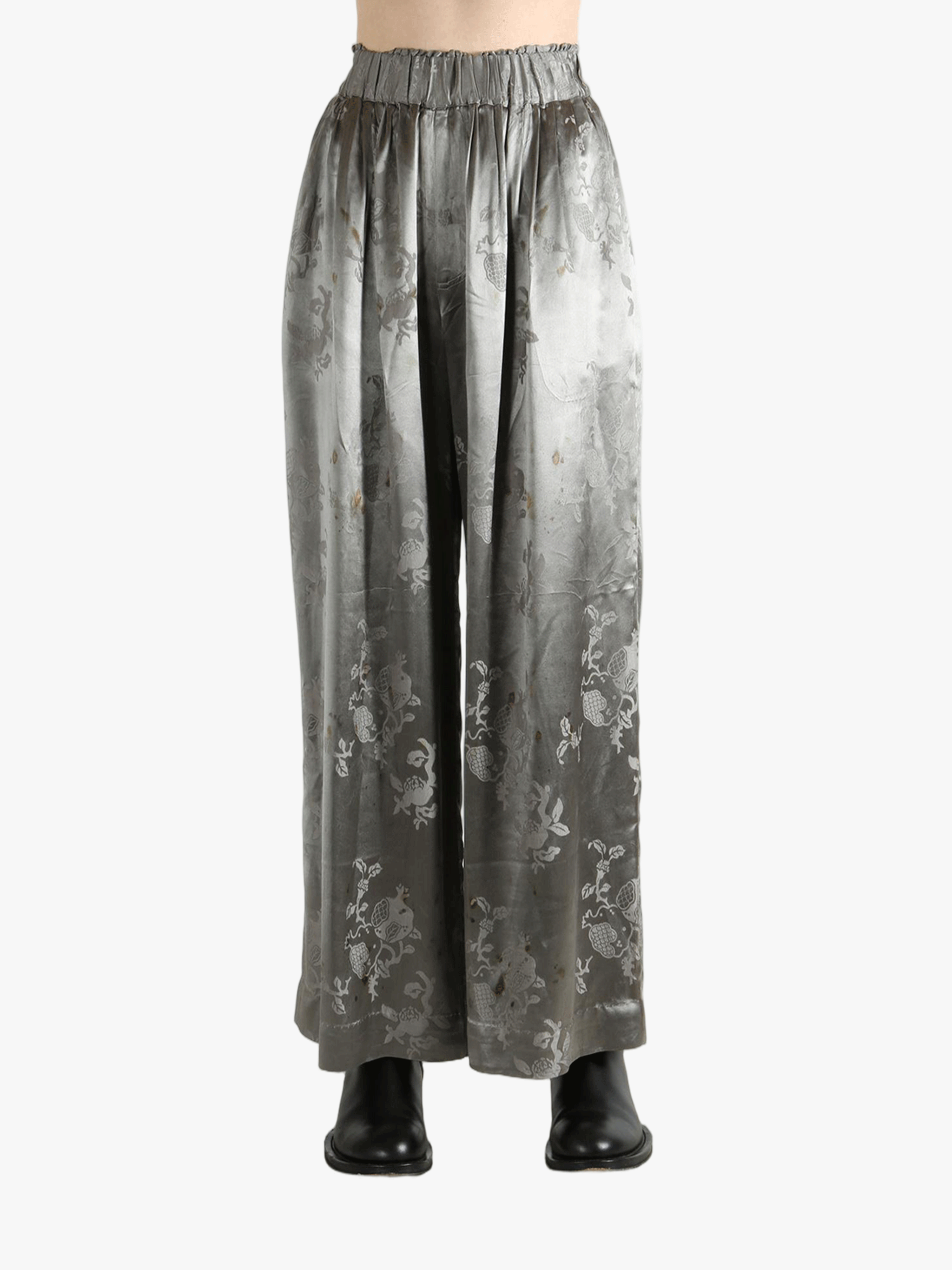 Grey pants worn by a person, showing the pants' fit