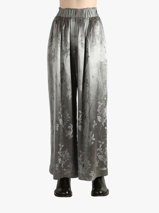 Grey pants worn by a person, showing the pants' fit