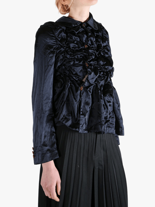 Navy jacket worn by a person, showing the jacket's fit