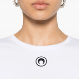 Close up of white t-shirt, showing texture of the orangic cotton fabric