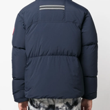 Blue jackets worn by a person, showing the jackets fit