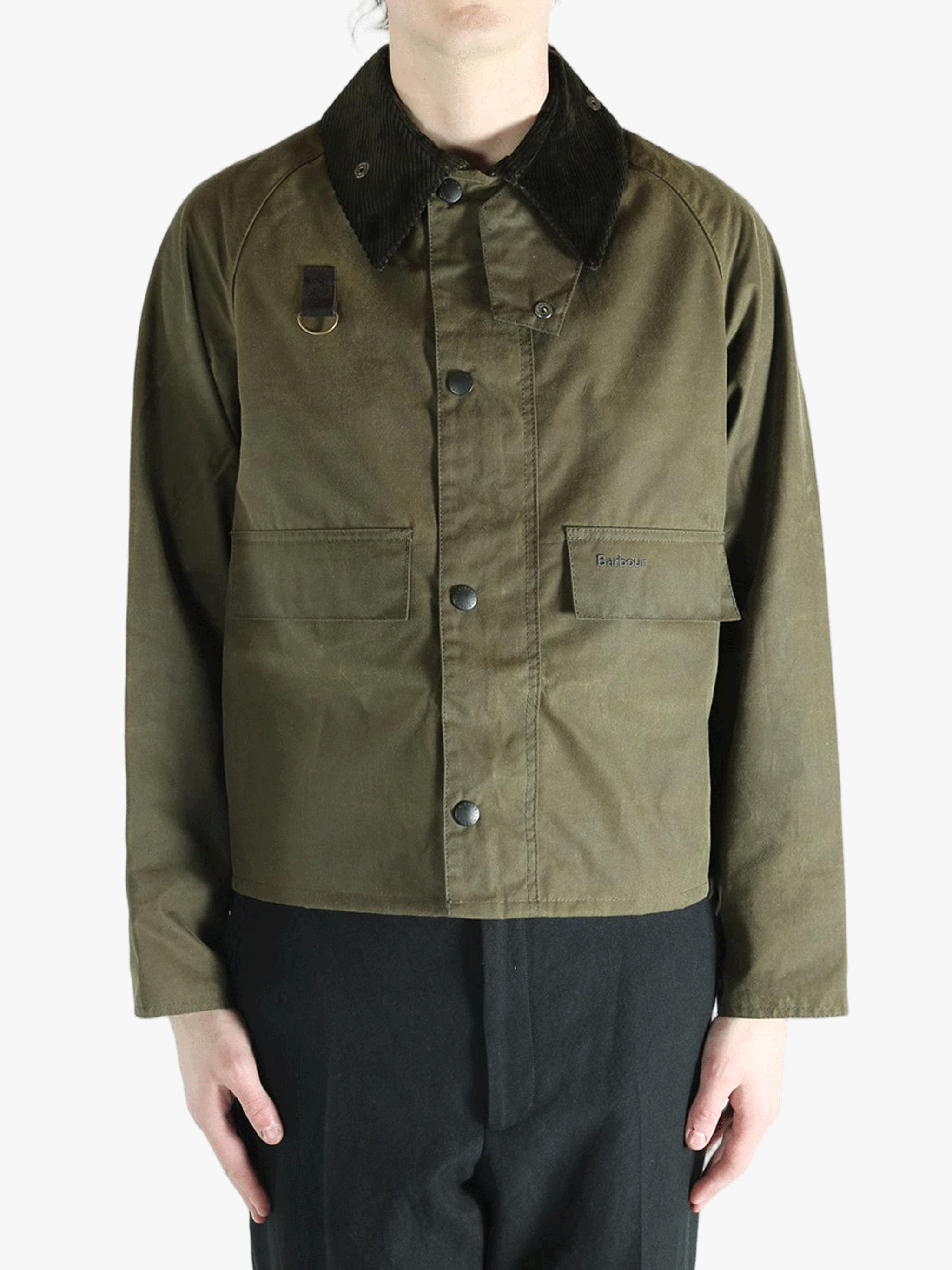 Green jacket worn by a person, showing the jacket fit