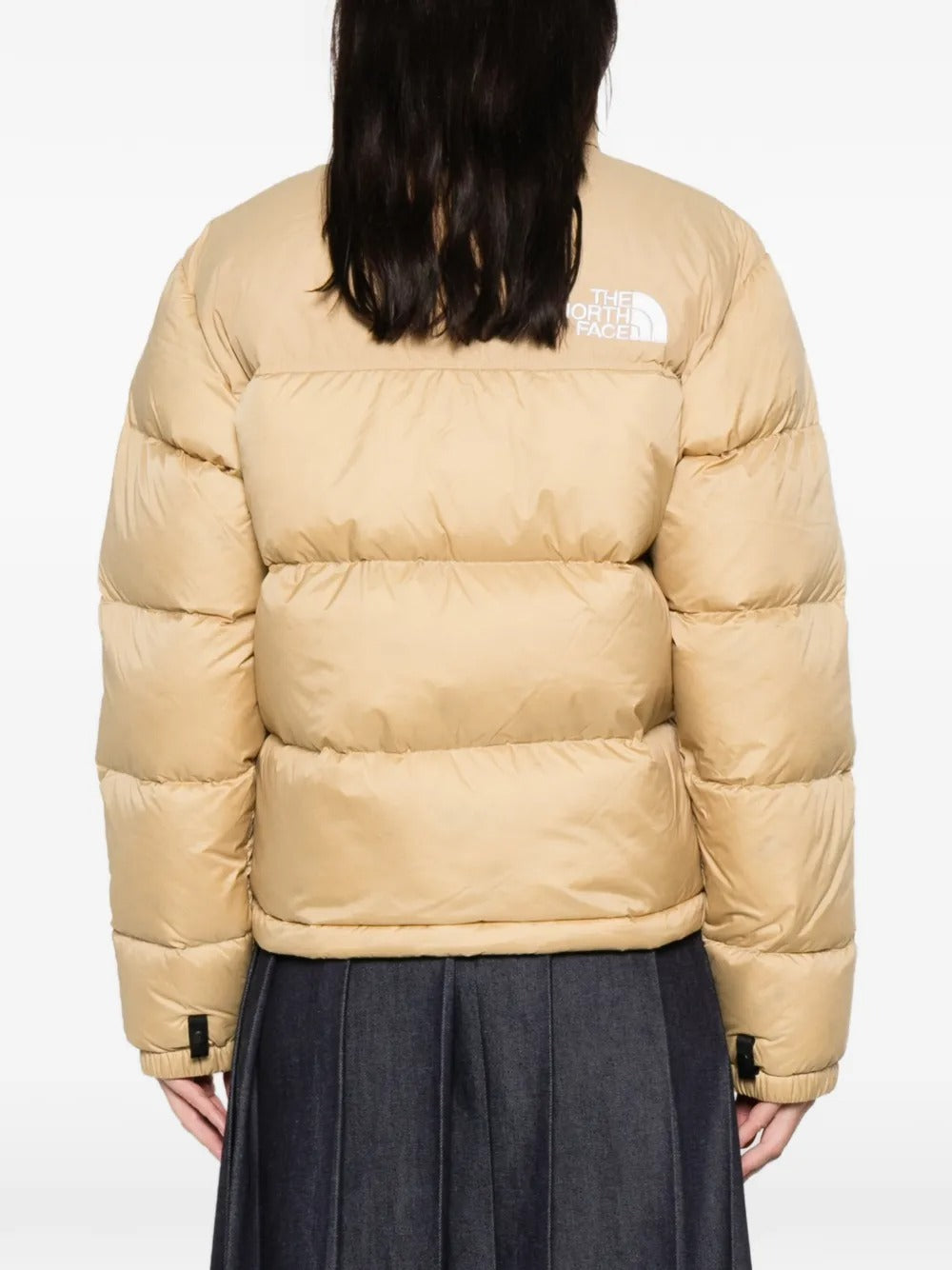 Tan jackets worn by a person, showing the  jackets fit