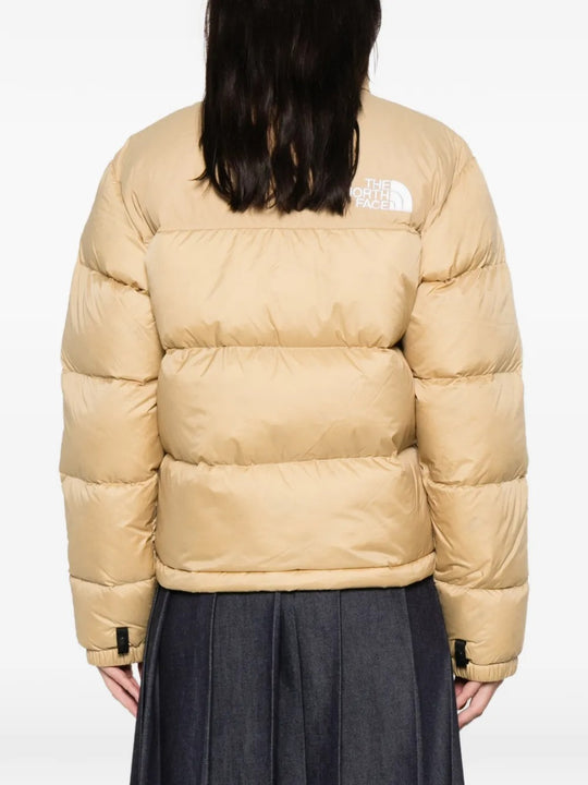 Tan jackets worn by a person, showing the  jackets fit