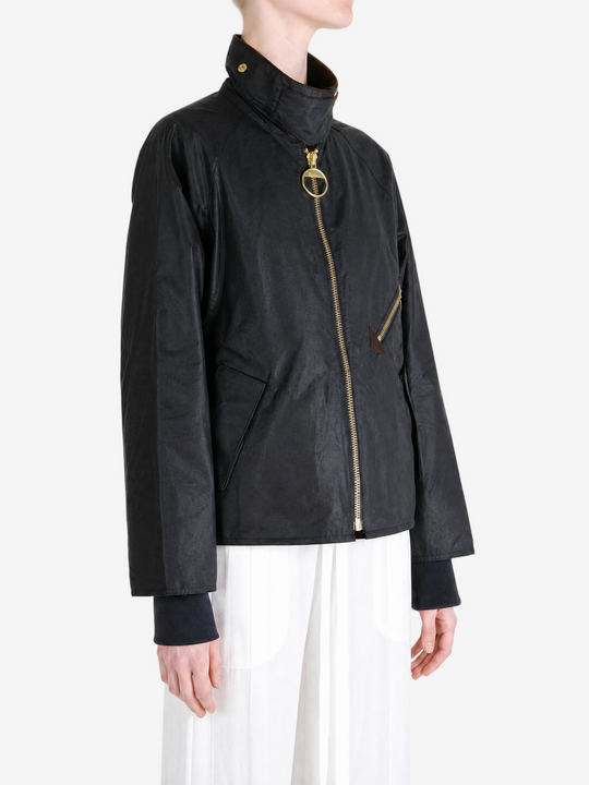 Black jacket worn by a person, showing the jacket fit