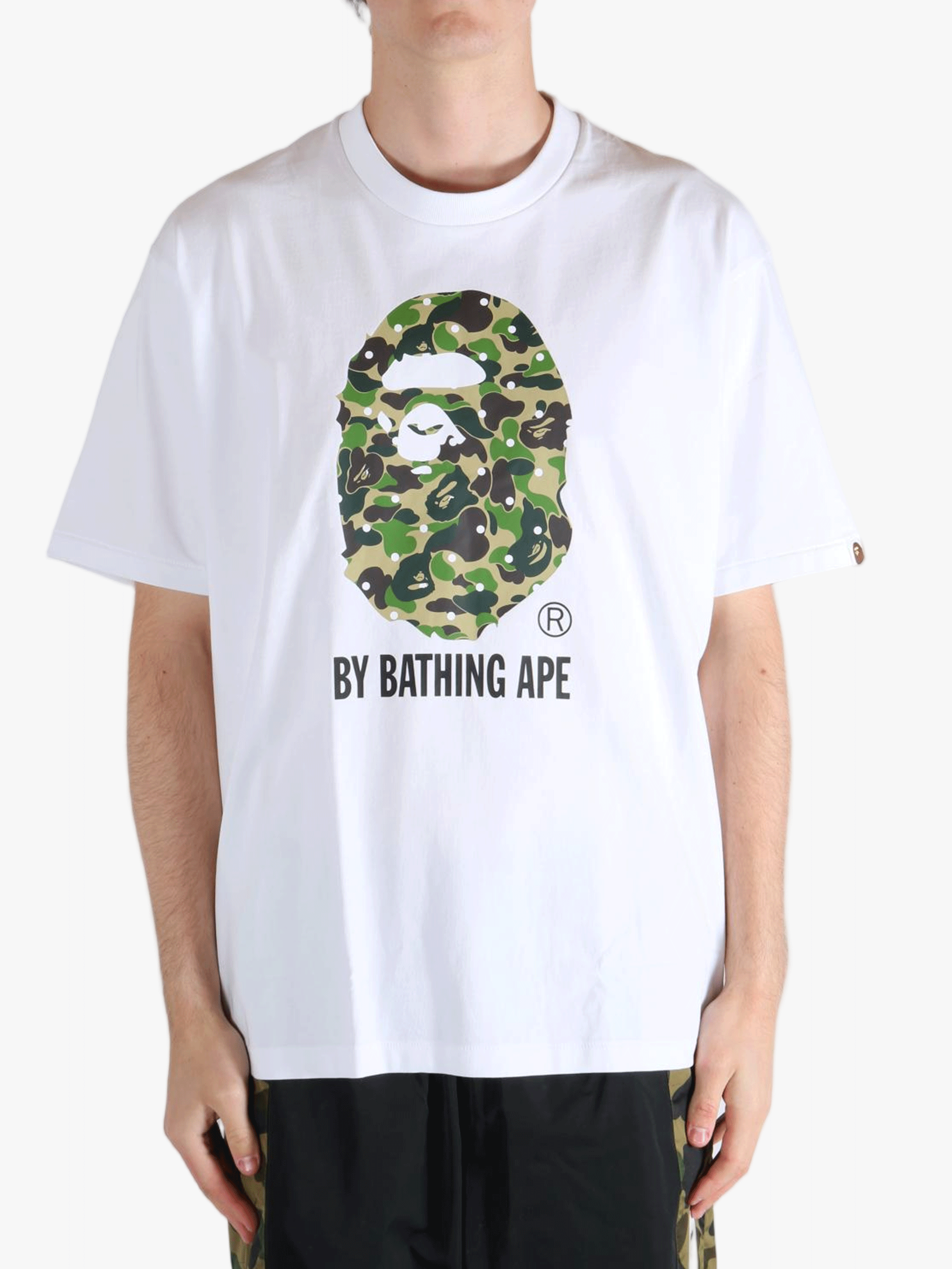 White T-shirt worn by a person, showing the t-shirt's fit