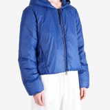 Blue jacket worn by a person, showing the jacket fit