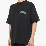 black t-shirt worn by a person, showing the t-shirt fit