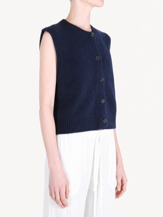 Navy top worn by a person, showing the top fit