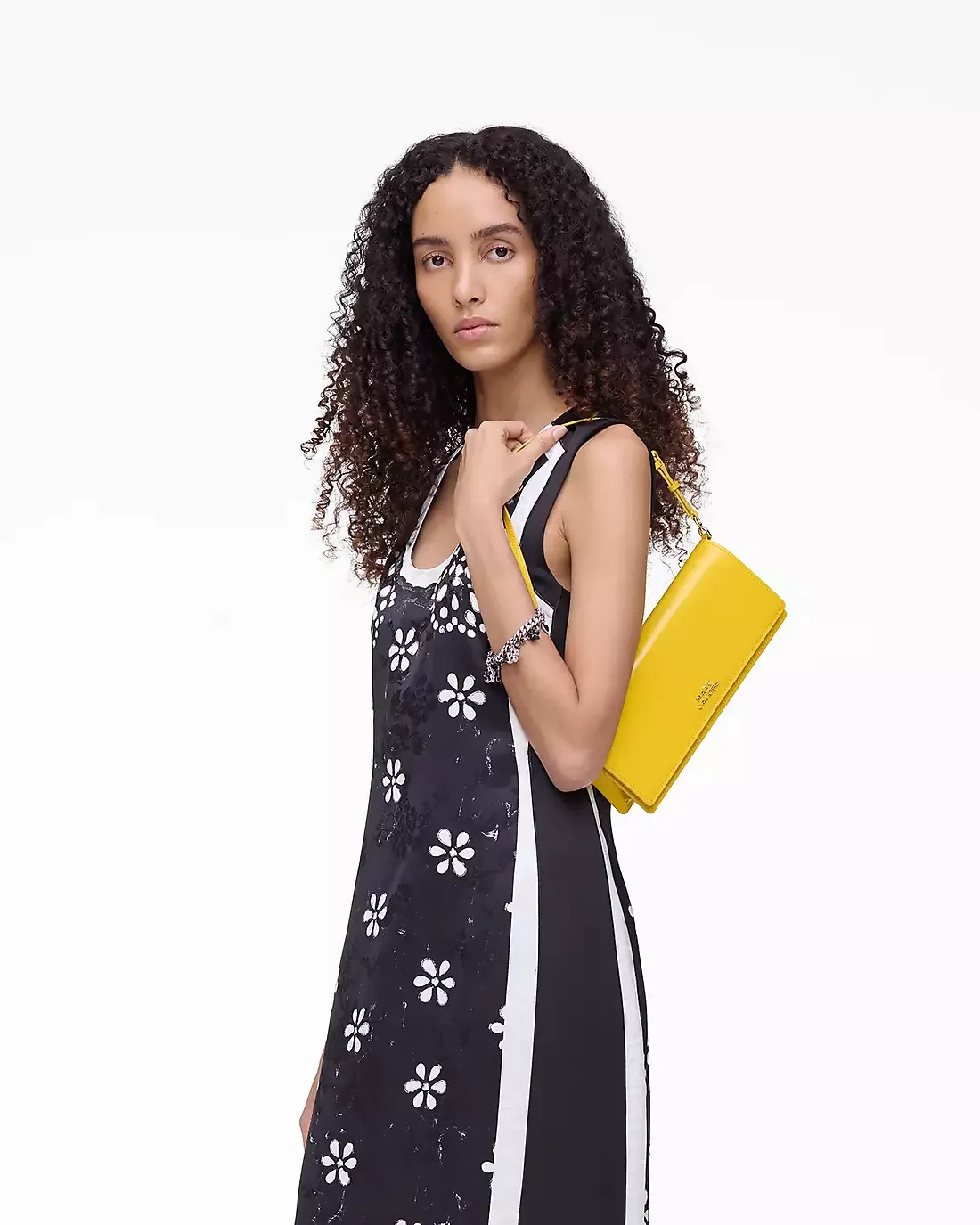 Yellow bag worn by a person, showing the bag's fit