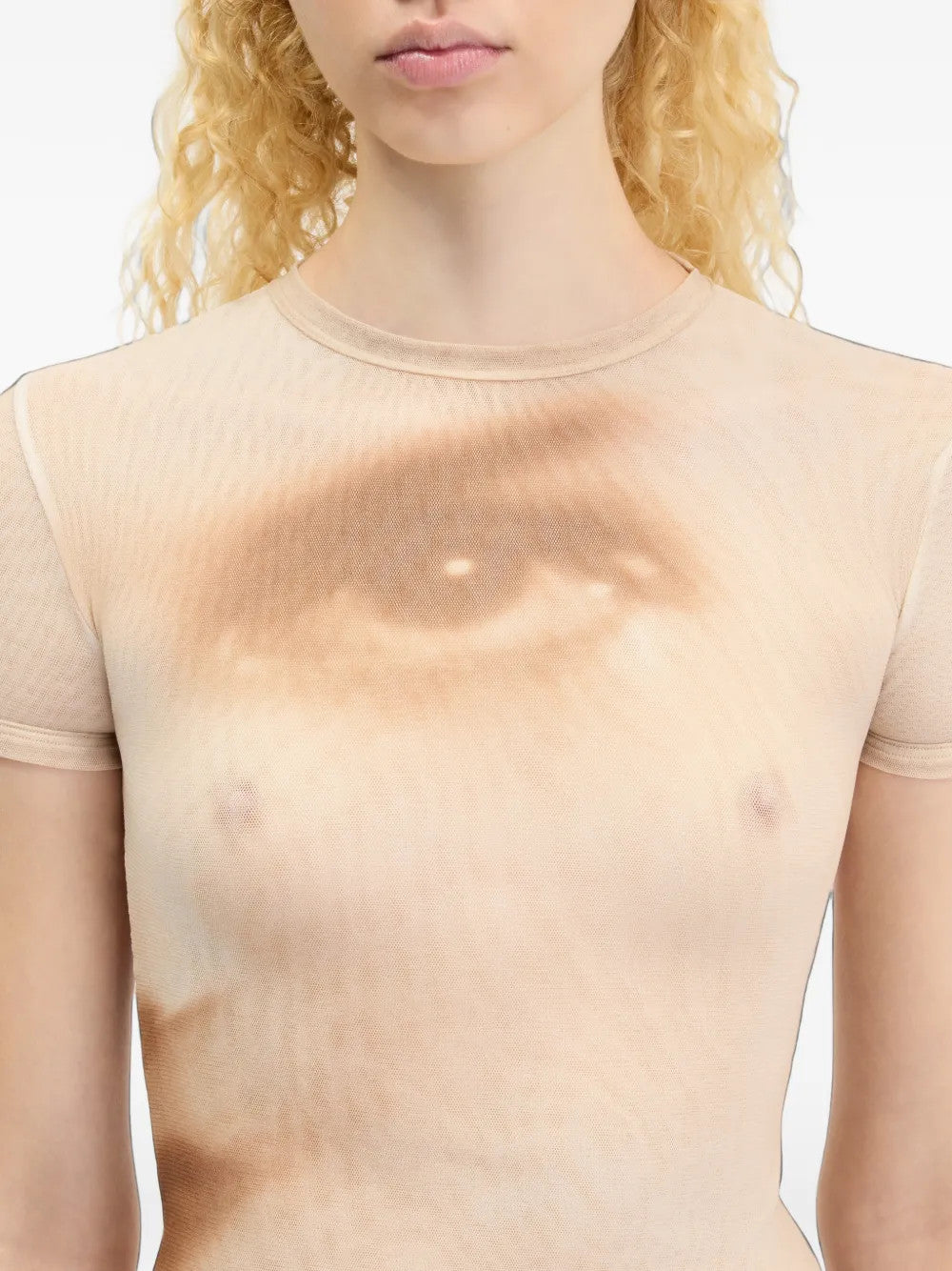 Tan t-shirt worn by a person, showing the t-shirt fit