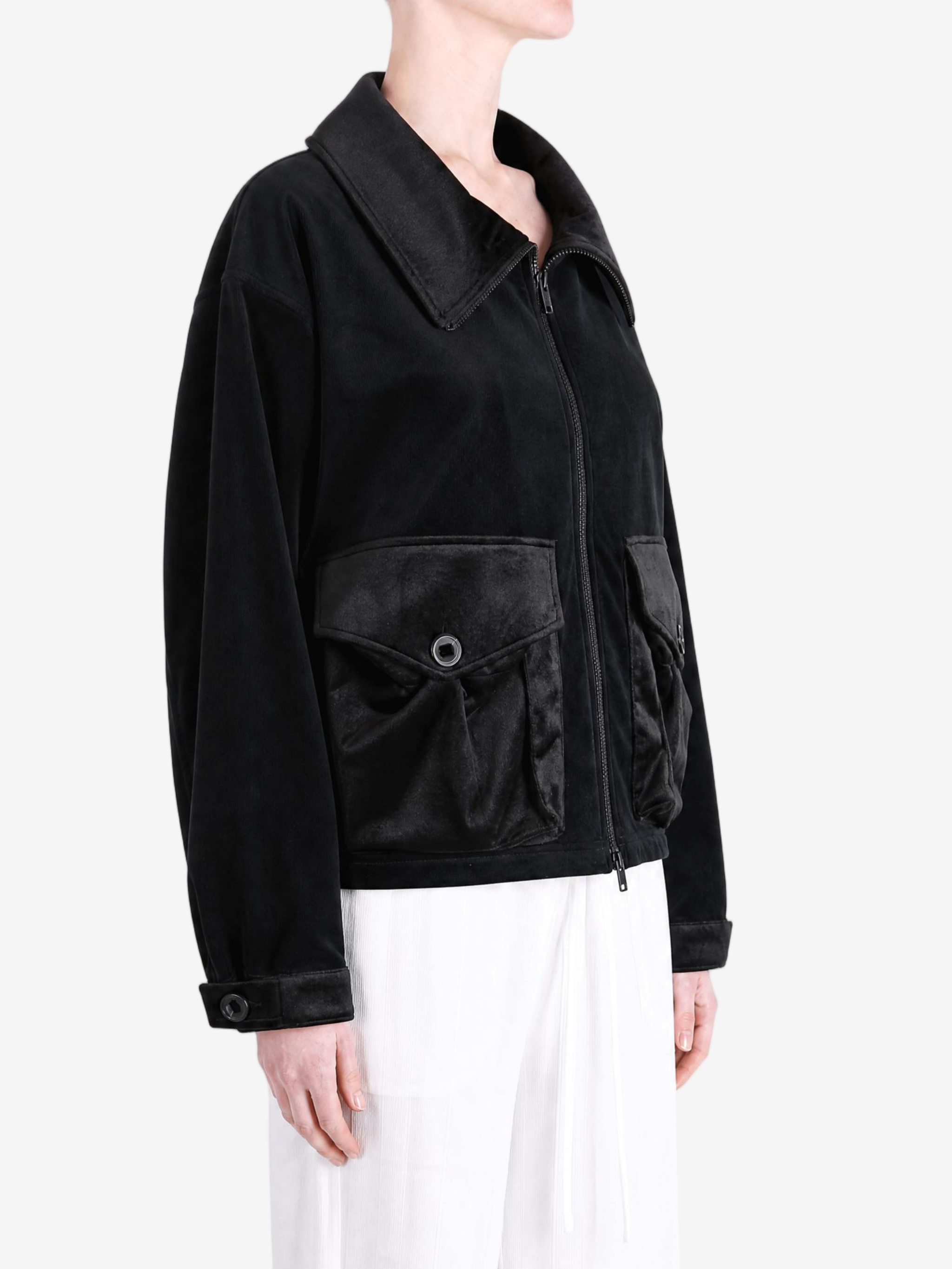 Black jacket worn by a person, showing the jacket fit