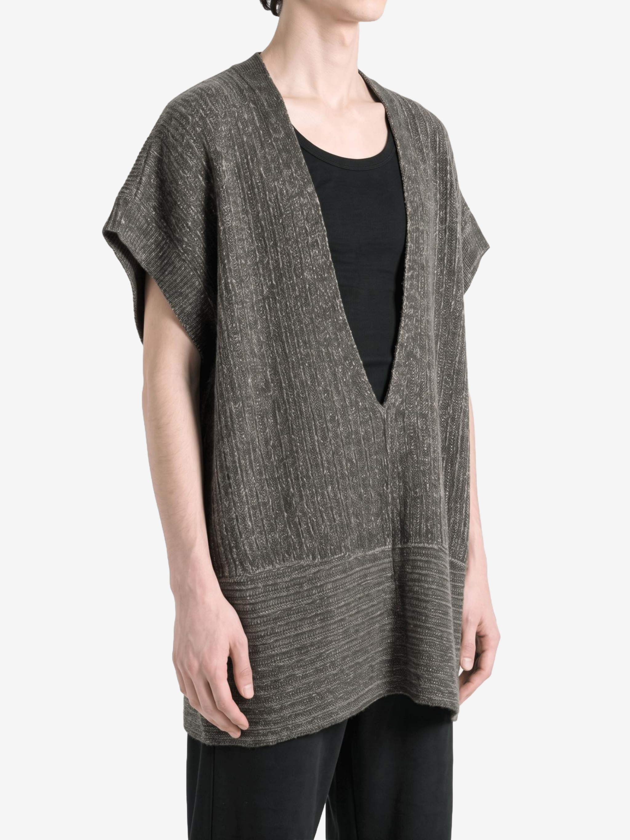 Grey knitwear worn by a person, showing the knitwear fit