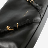 Close up of black bag,showing texture of the leather fabric.