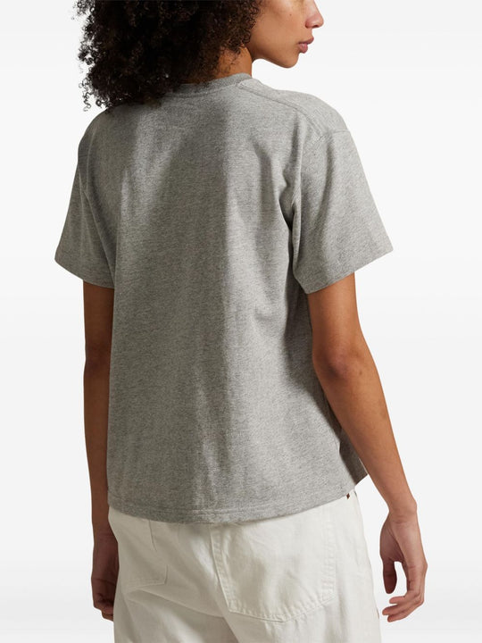 Gray t-shirt worn by a person, showing the t-shirt fit
