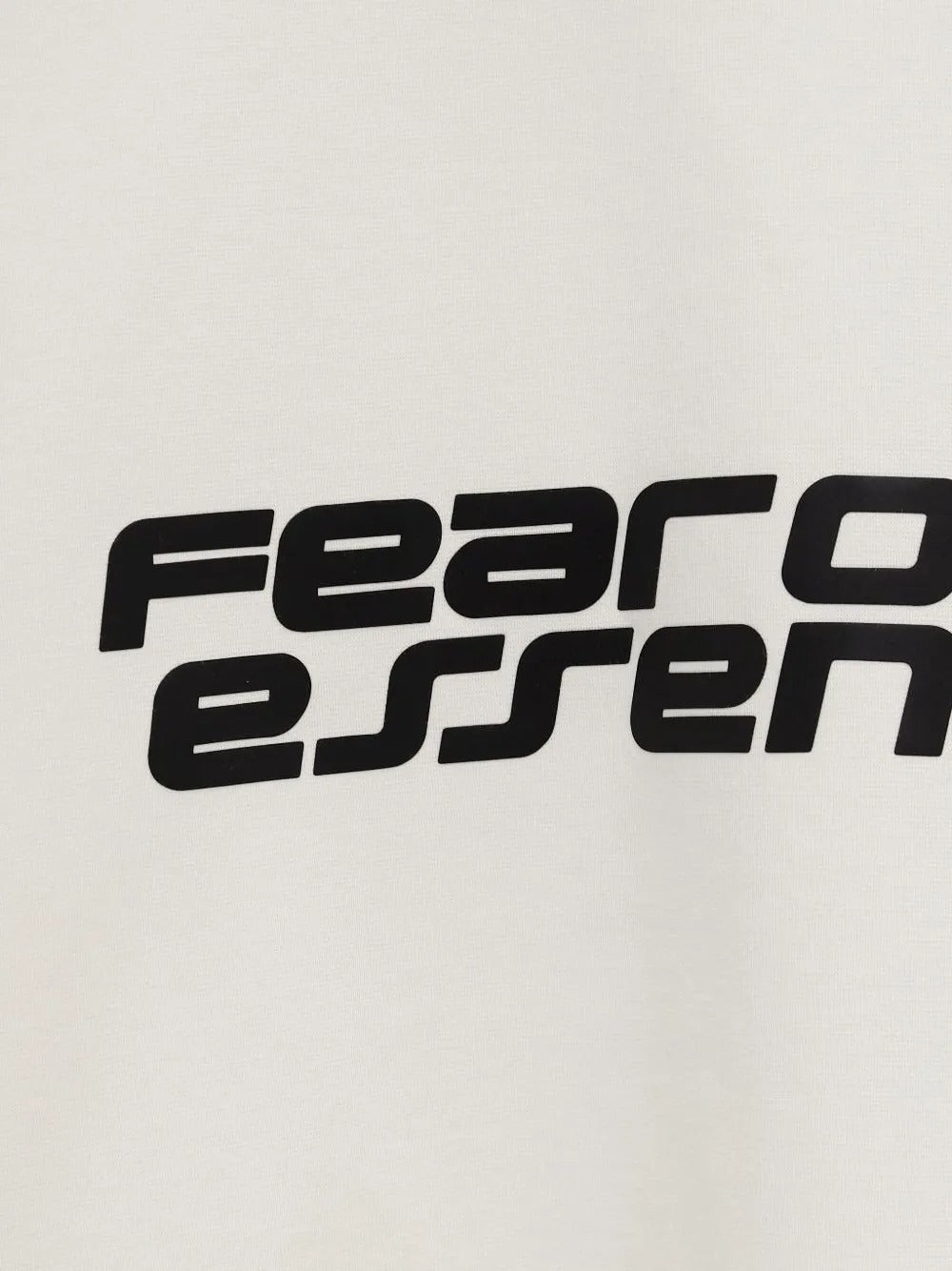 Close up of the white t-shirt, showing texture of the polyester and cotton fabric