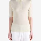 Tan knitwear worn by a person, showing the knitwear fit