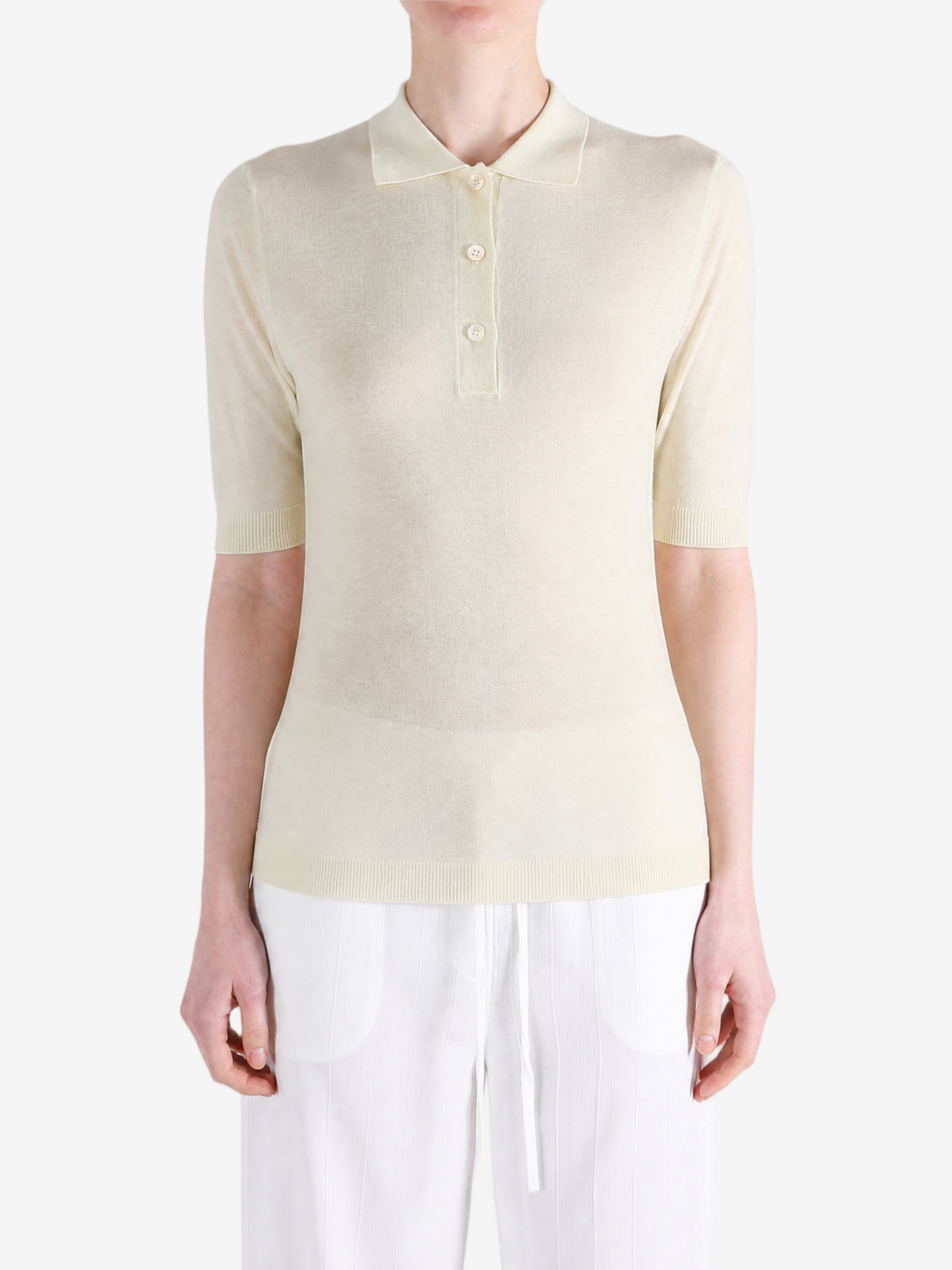Tan knitwear worn by a person, showing the knitwear fit