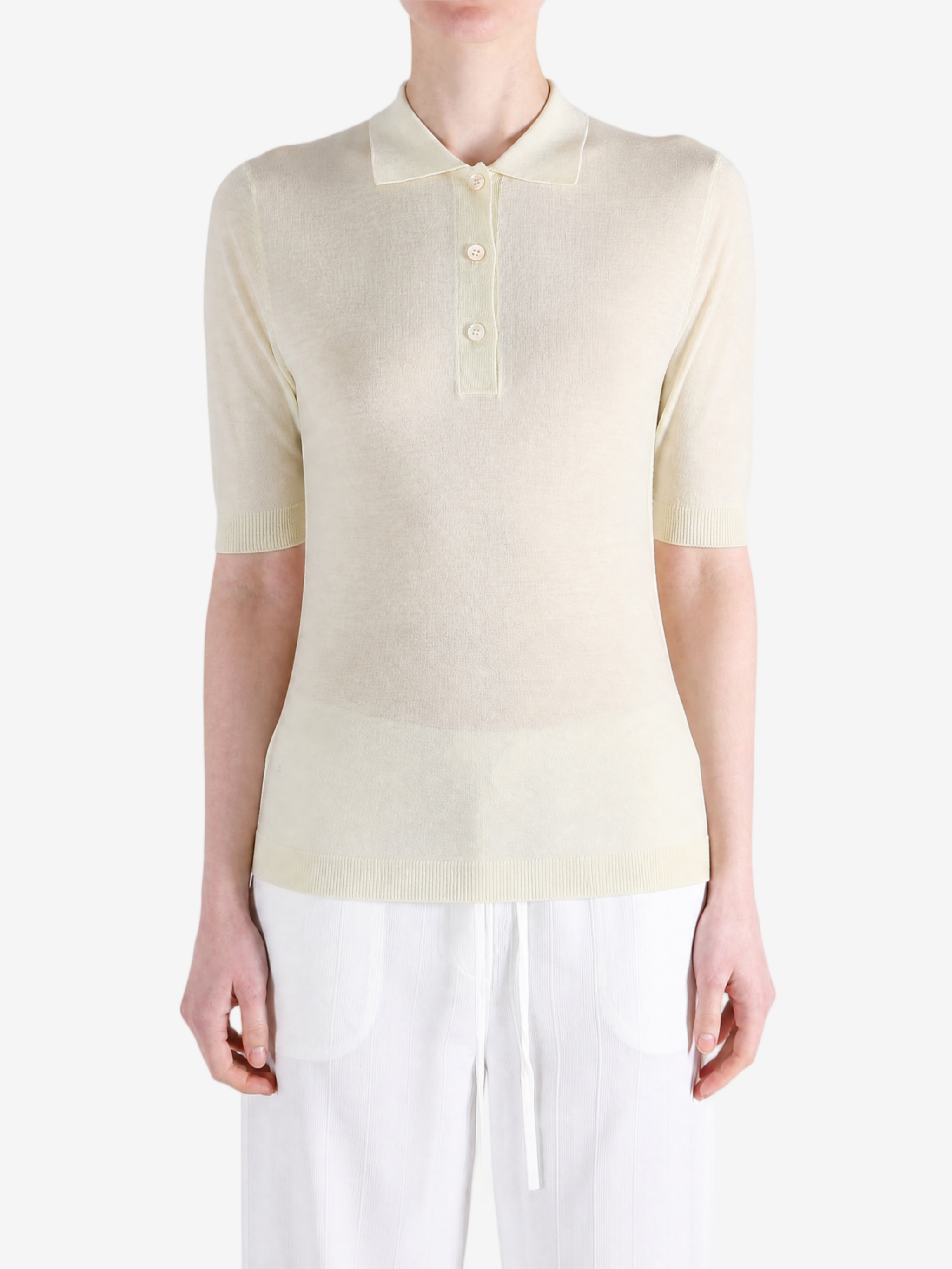 Tan knitwear worn by a person, showing the knitwear fit
