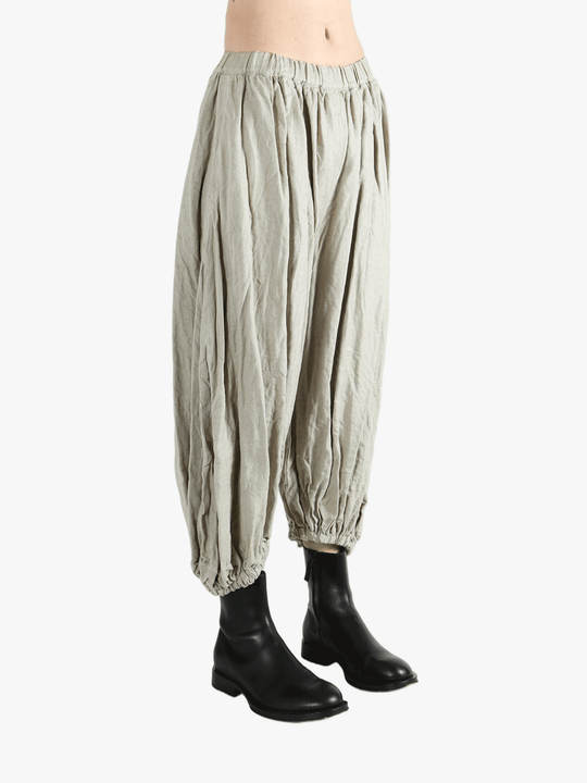 Grey pants worn by a person, showing the pants fit