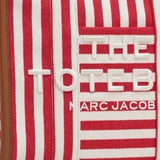 Close up of red bag, showing texture of the cotton fabric
